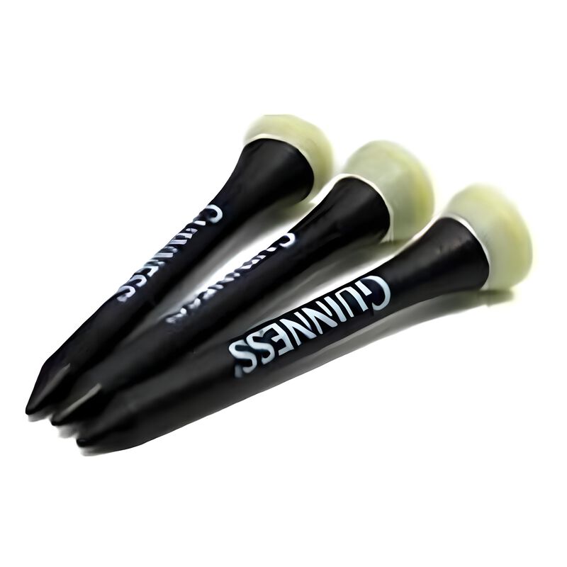 Three black golf tees with white tips arranged on a white background