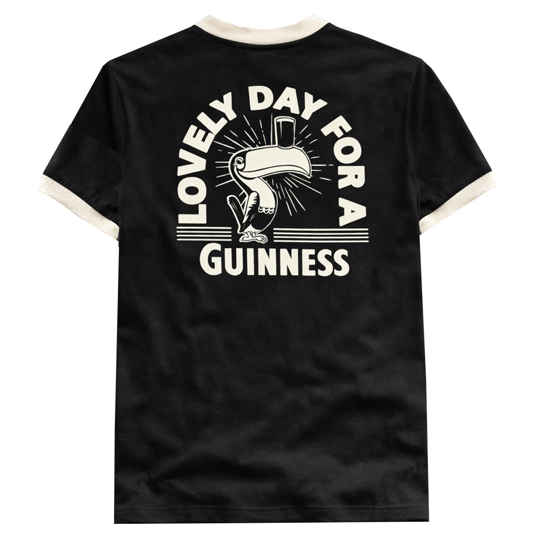 Back view of black t-shirt with a large cream graphic of a toucan and the text Lovely Day for a Guinness.