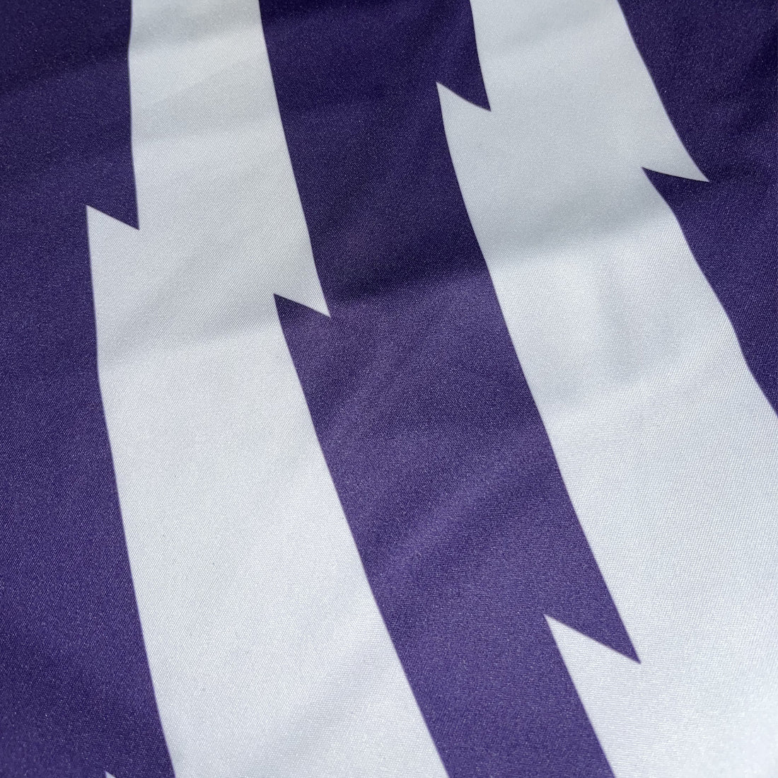 Purple fabric with bold white chevron stripe graphic