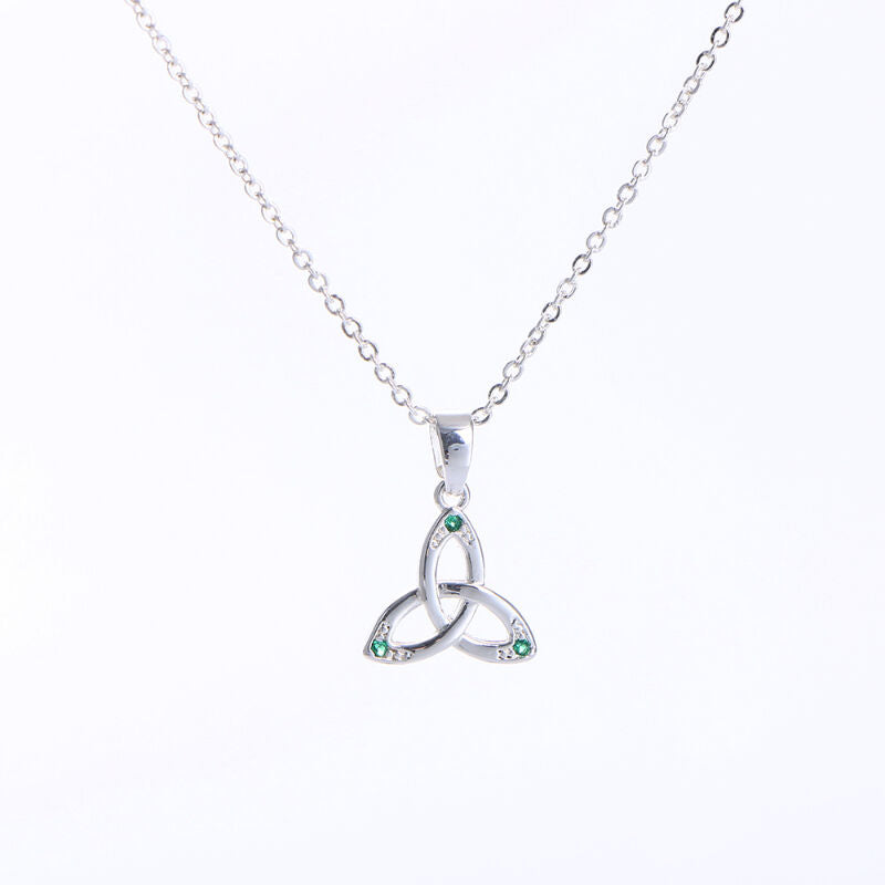 Silver necklace with a Celtic knot pendant adorned with small green stones