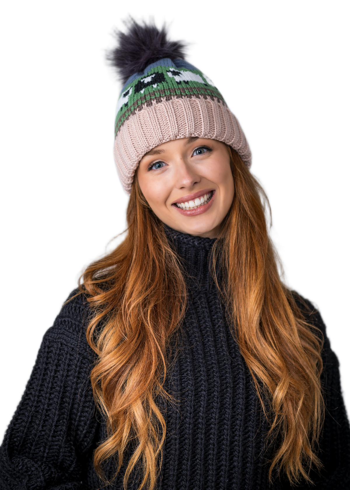 Smiling woman with long red hair wearing a knitted hat and black sweater