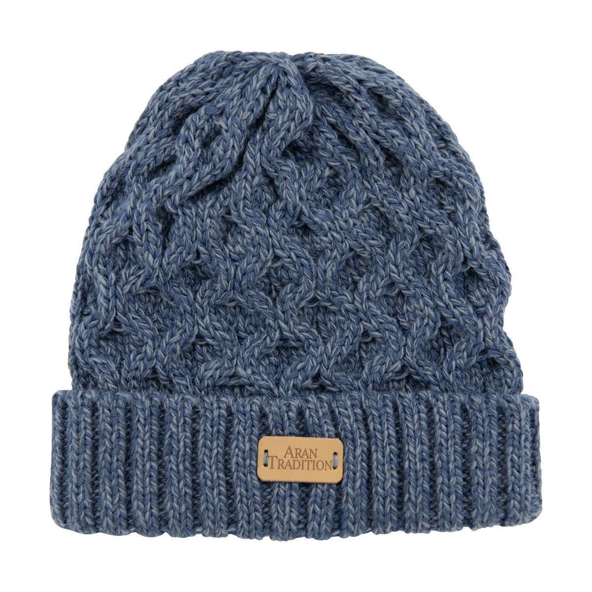 Denim blue mix Aran beanie with chunky cable knit and a folded ribbed cuff with a tan leather label.