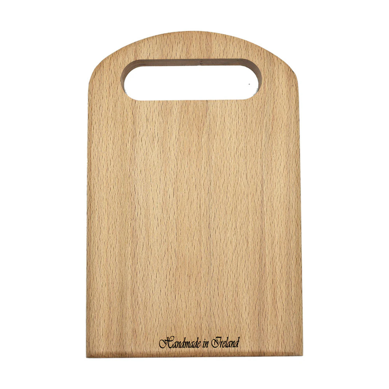 Small wooden chopping board with rounded handle cutout and handmade in Ireland inscription.