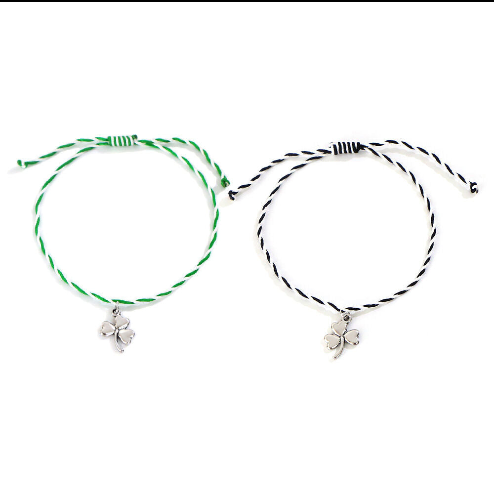 Two braided string bracelets with silver four-leaf clover charms