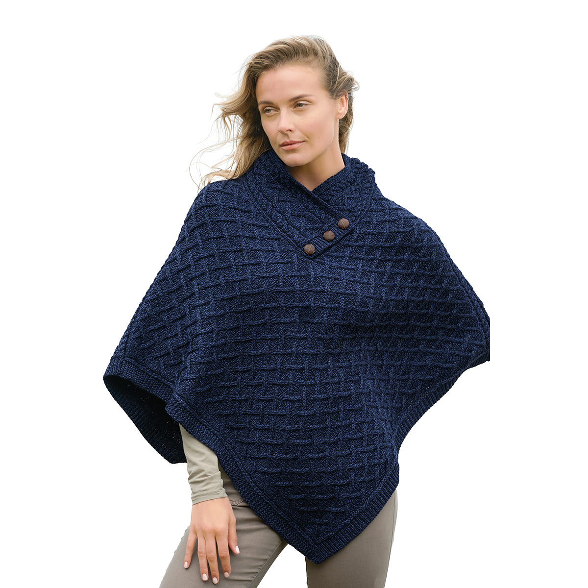 NUA Ink Super Soft Merino Poncho in navy worn by a model with a textured knit and button details