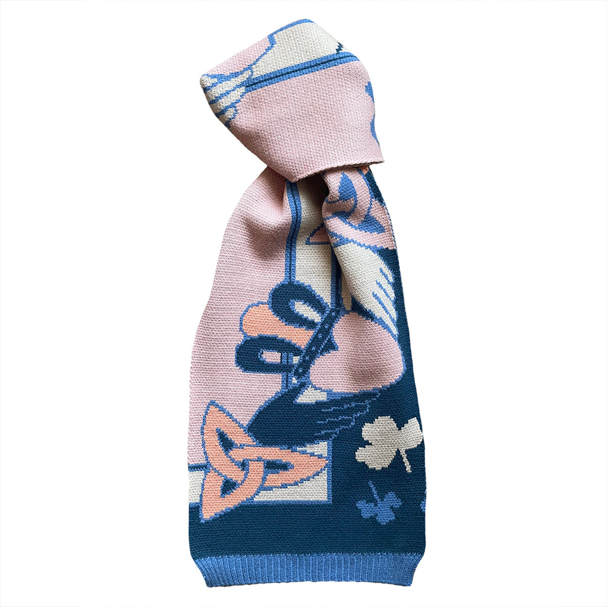 Studio shot of the pink and blue patterned knit scarf folded and displayed.