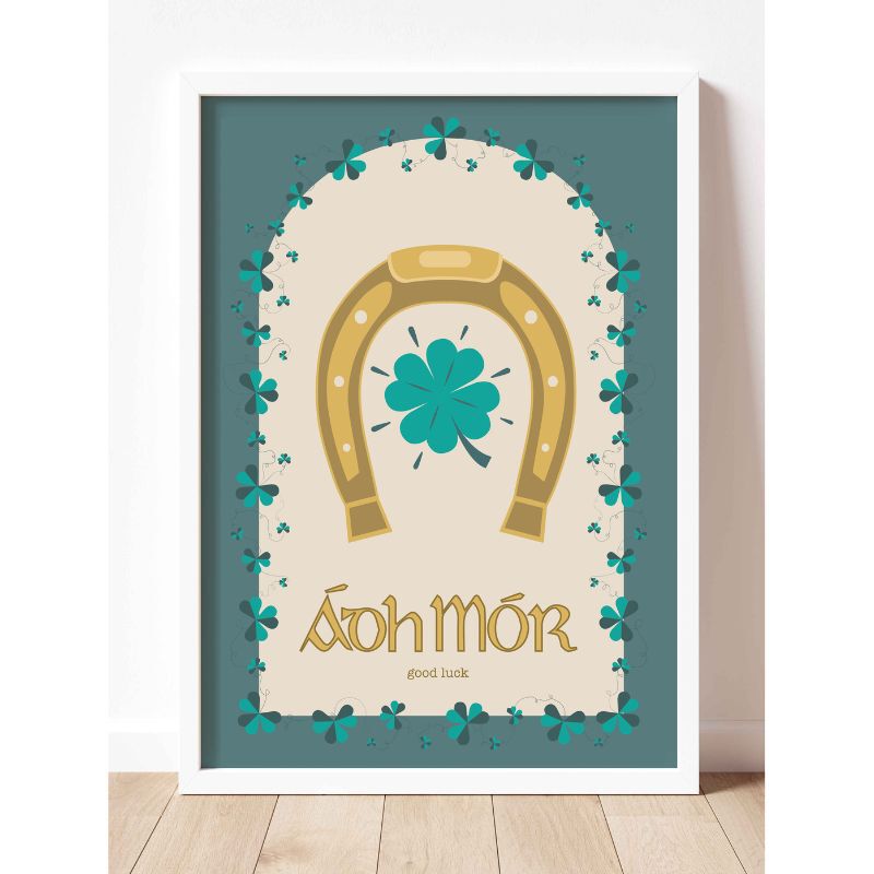 Framed A5 Irish print featuring a gold horseshoe and teal shamrocks surrounding Ádh Mór.