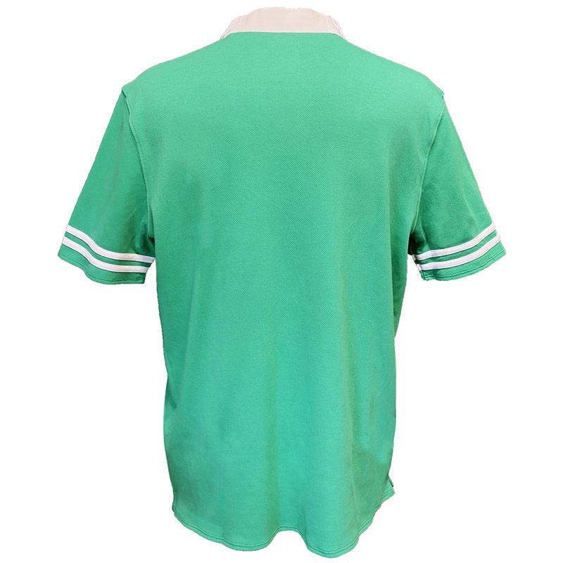 Back view of green Landsdowne Ireland Shamrock polo shirt with white striped sleeve cuffs