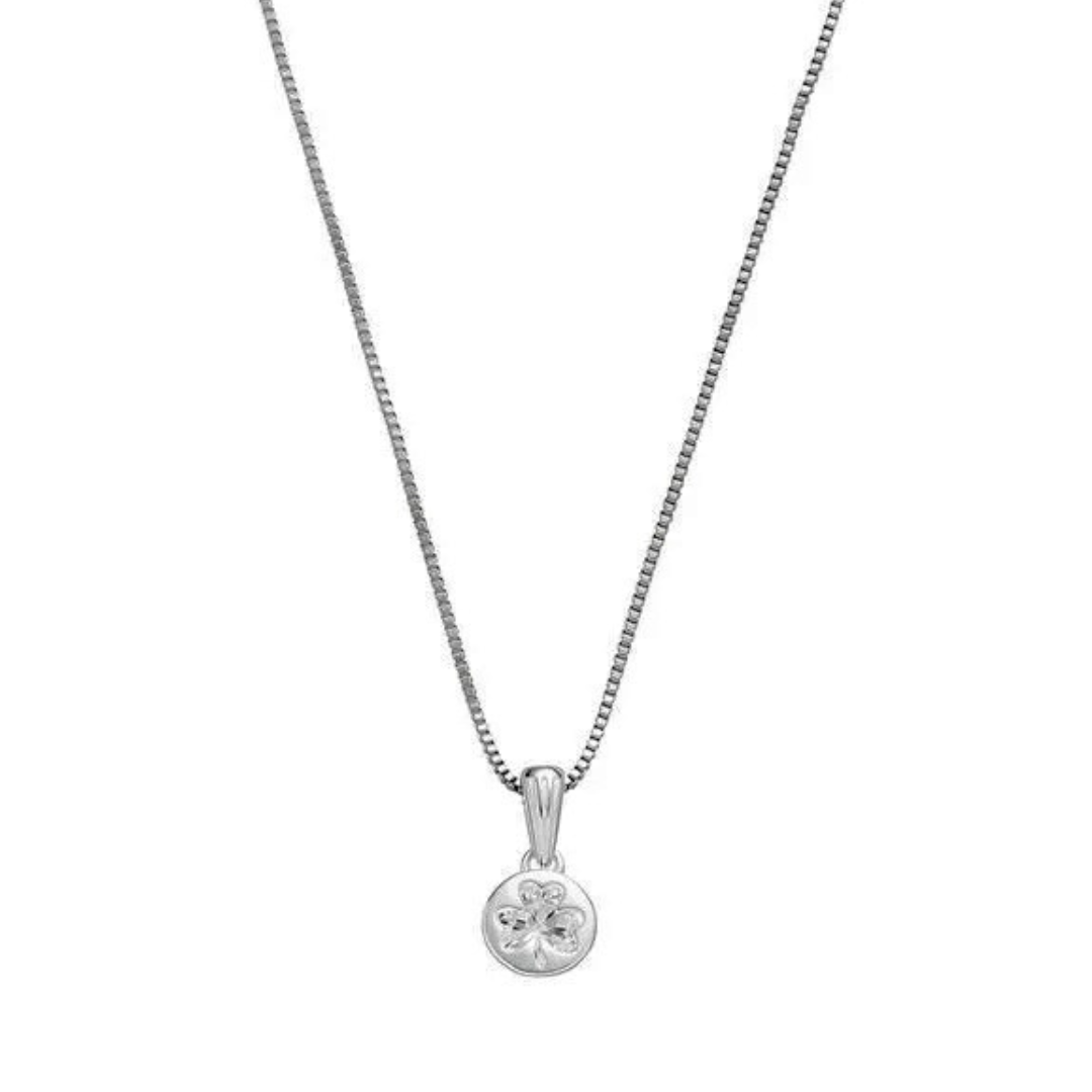Silver necklace with a round pendant featuring a four-leaf clover design