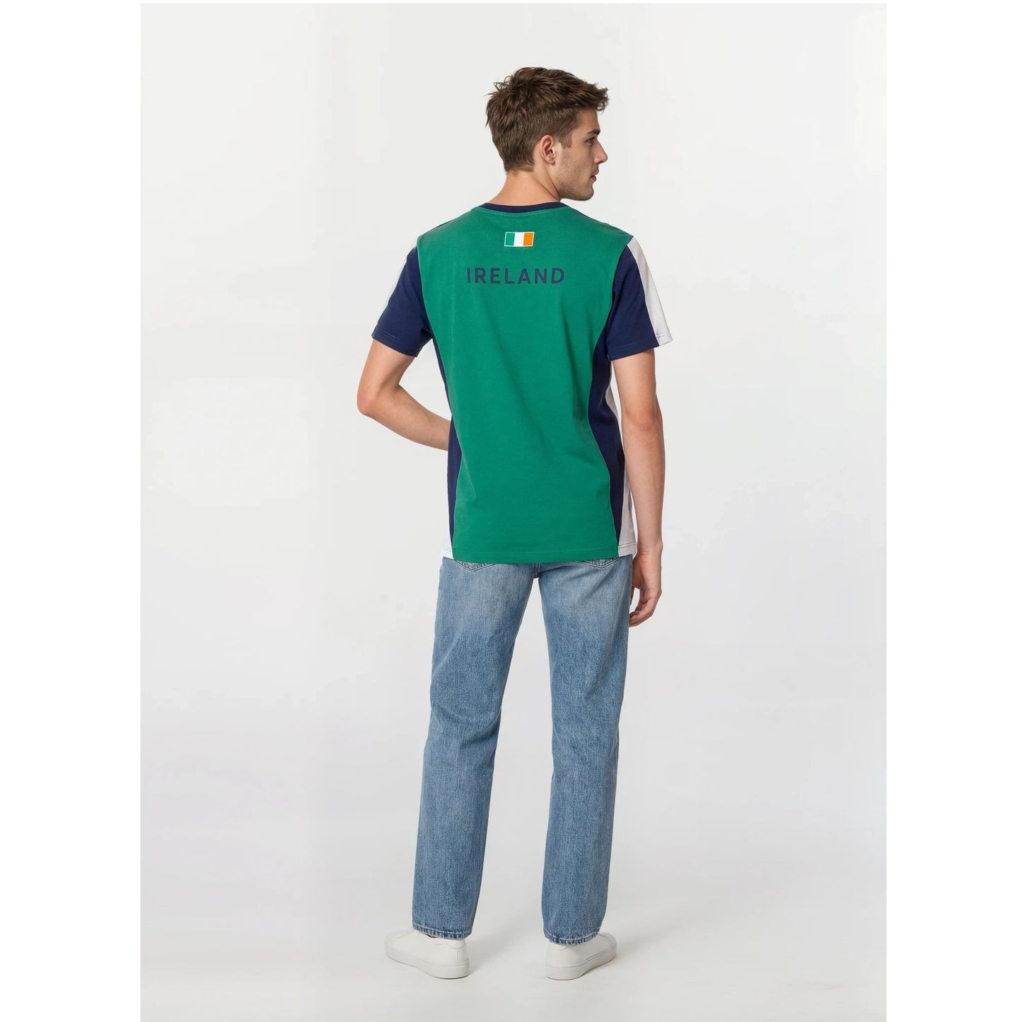 Back view of a male model wearing Ireland Colorblock Unisex T Shirt in green with navy side panels and IRELAND on the back