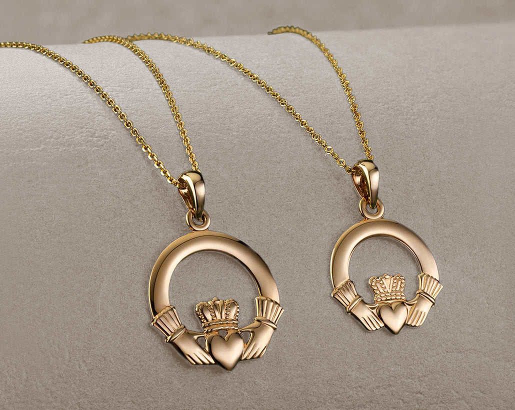 Two gold  claddagh necklaces