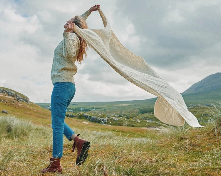 A woman running wearing Aran