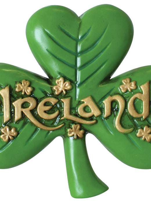 Green shamrock with gold lettering spelling Ireland and small shamrocks