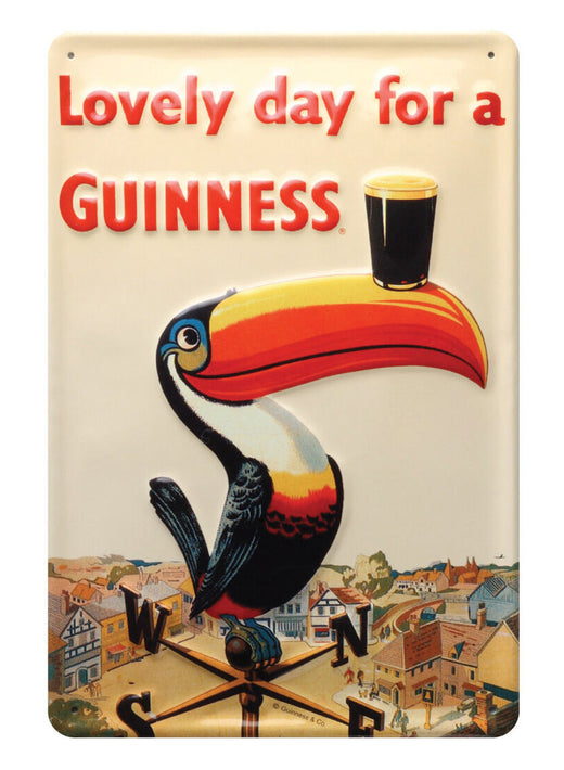 Colorful toucan balancing a pint of dark beer on its beak above a town