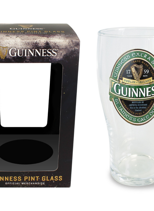 Clear pint glass with Guinness logo beside empty black Guinness box