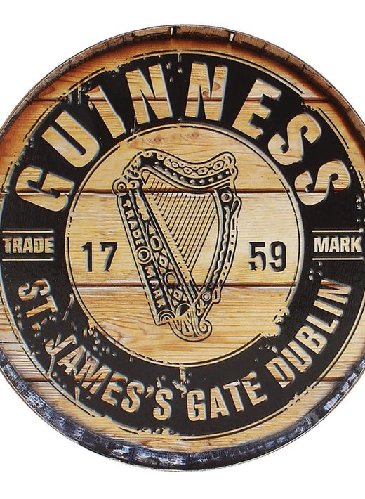 Round wooden sign with Guinness harp logo and St. James's Gate Dublin text