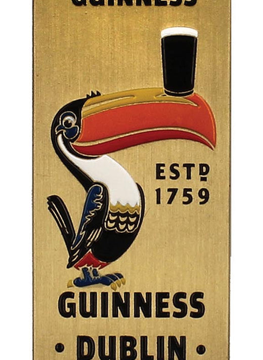 Brass toned Guinness bottle opener with toucan illustration and the phrase Lovely Day For A Guinness