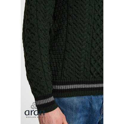 Close up of dark green Aran knit texture with ribbed cuff and gray stripe detail from the Inishbeg sweater