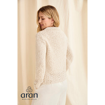 Back view of cream Eriu cardigan with textured knit and decorative lace hem.