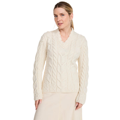 Cream Tralee V-Neck Super Soft Merino sweater on a model with cable knit texture