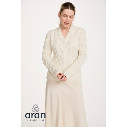 Cream cable knit Merino V-neck sweater worn by a model