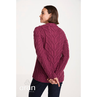 Model seen from the back in a magenta cable knit Tralee V-Neck Supersoft Merino Sweater showing the relaxed fit