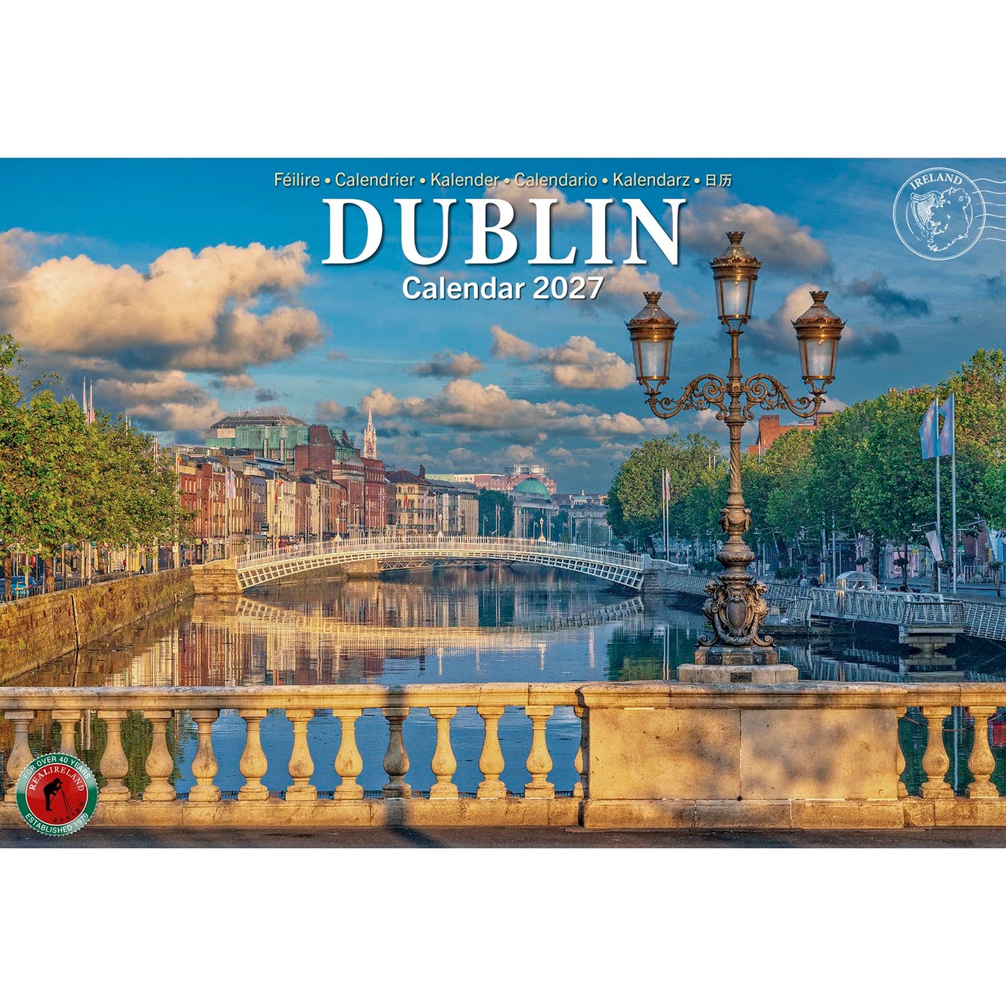 Dublin Calendar 2027 cover showing the Liffey river, a stone bridge, and an ornate lamppost against a blue sky.