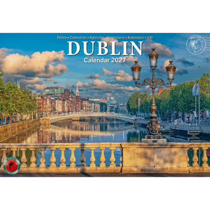 Dublin Calendar 2027 cover showing the Liffey river, a stone bridge, and an ornate lamppost against a blue sky.