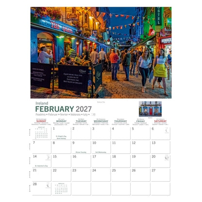 Bustling night street view with colorful pubs and blue buildings near The Quays pub as people wander