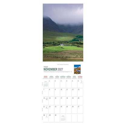 Irish landscape calendar page showing a farm cottage in a lush valley with green fields and misty mountains, November 2027 grid.