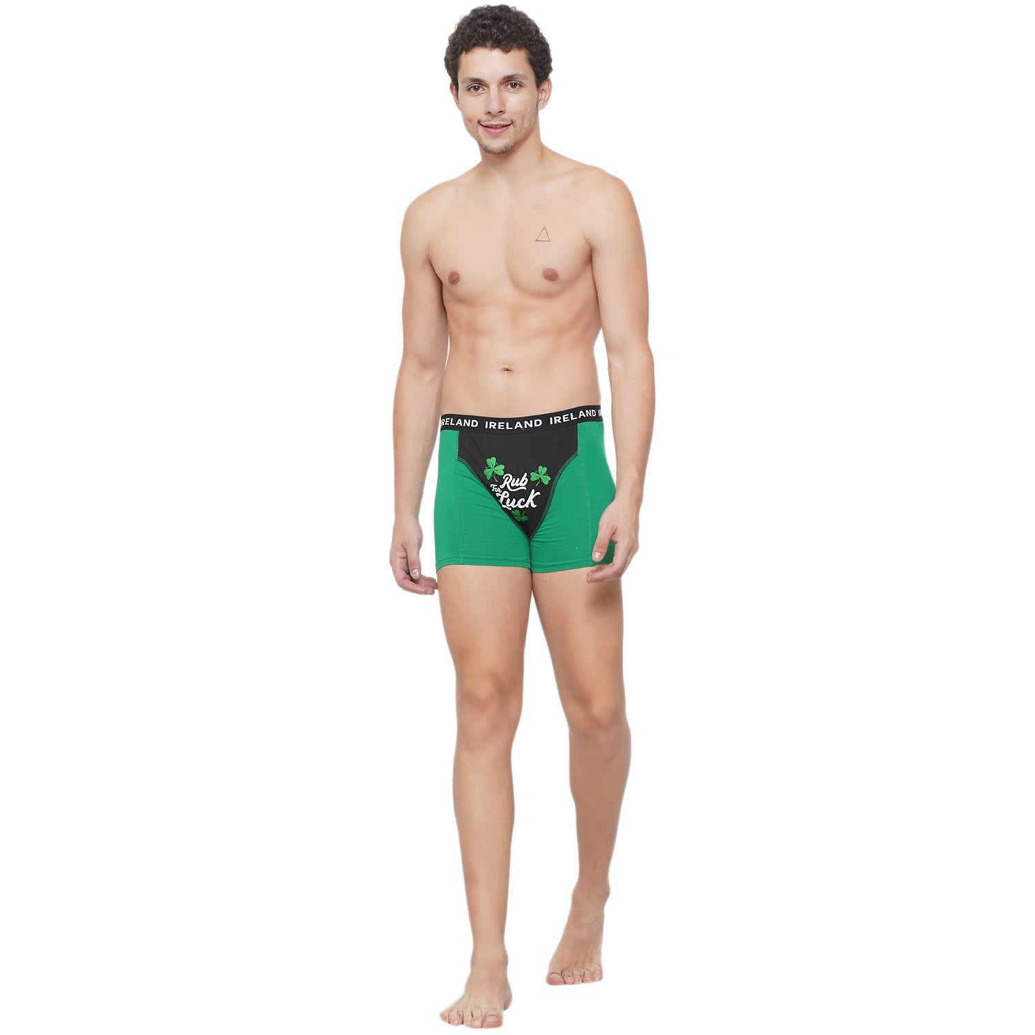 Male model wearing green Rub for Luck boxer briefs with black front panel and shamrock print.