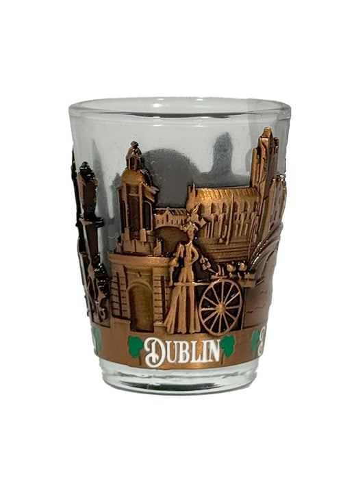 Clear shot glass with copper Dublin skyline relief and a DUBLIN banner.