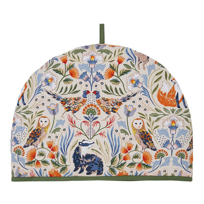 Blackthorn Tea Cozy with botanical and bird motifs on cream fabric and green trim