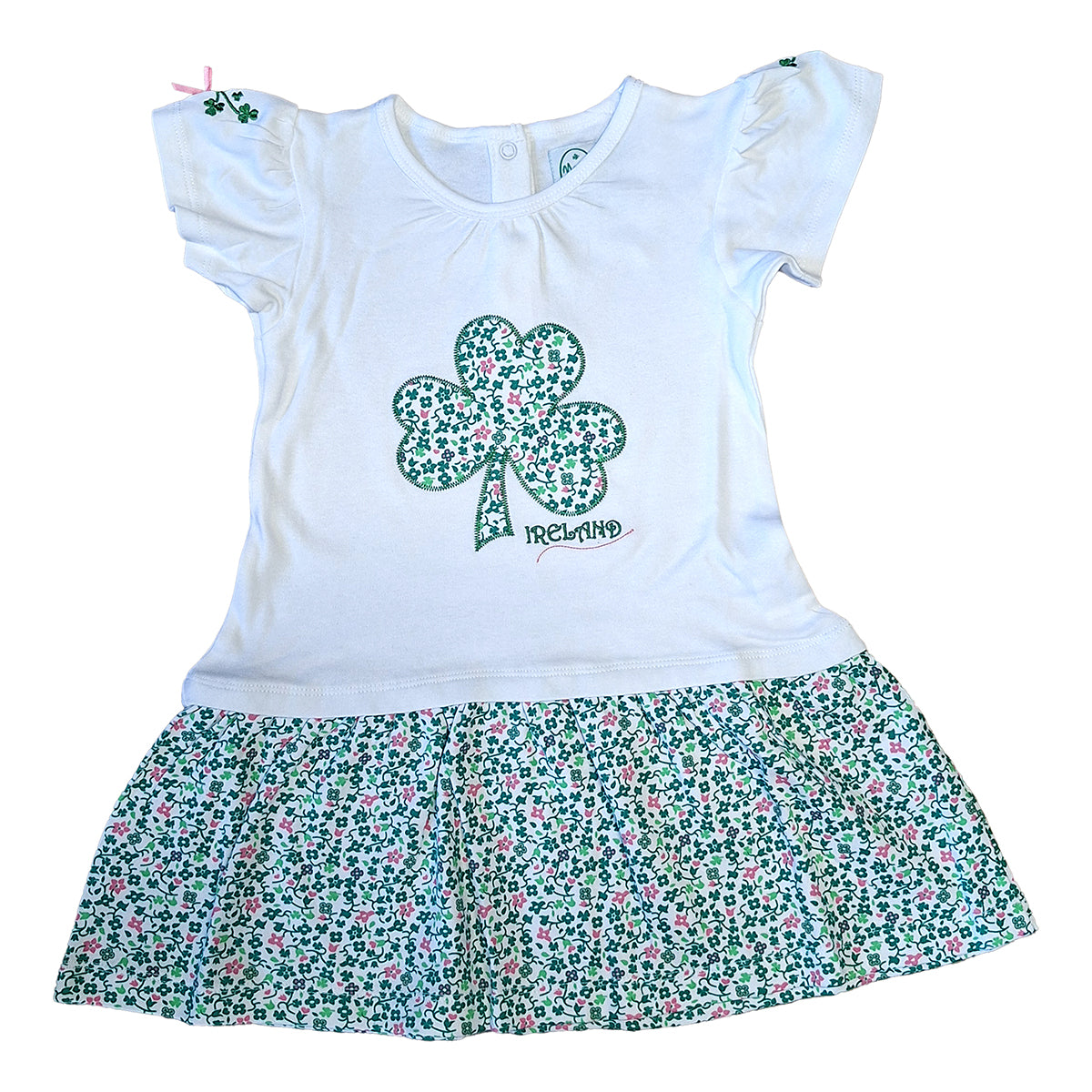White kids dress with a shamrock applique on the chest and a floral printed frill skirt