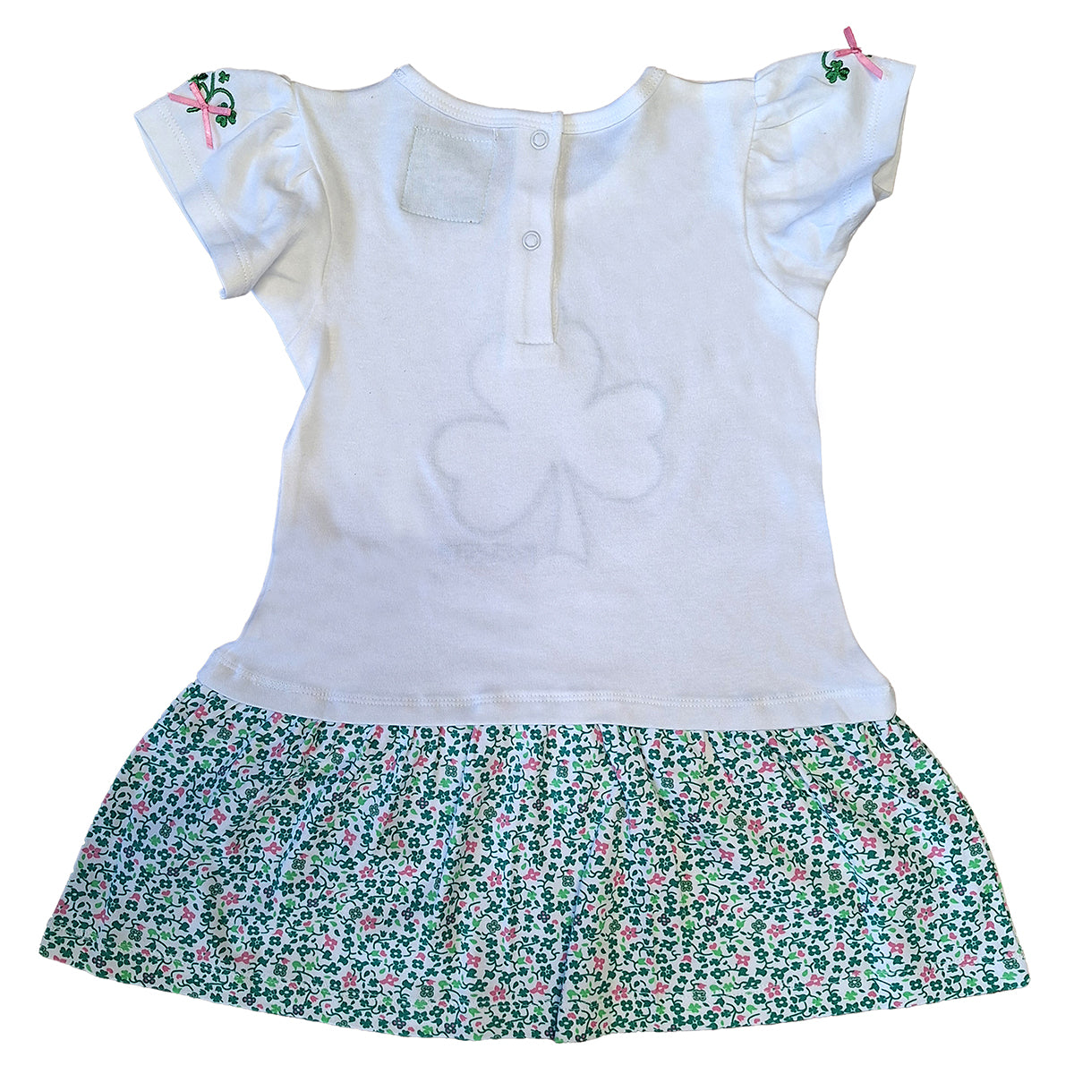 Back view of white Shamrock Applique Kids Frill Dress showing a back placket with snaps and a floral printed skirt.