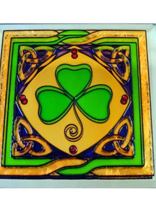 Square decorative tile with green shamrock and Celtic knot patterns