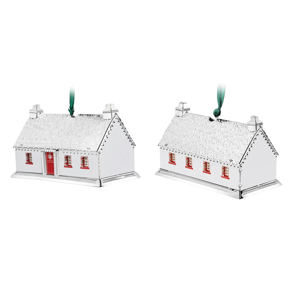 Pair of silver Thatched Cottage keepsake decorations with red window accents and green ribbons for hanging.