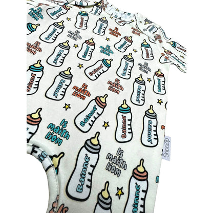 Allover bottle print on a Snoozip Bainne baby onesie with aqua cuffs and a small tag