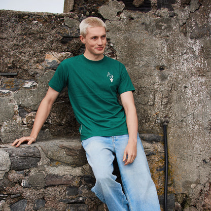 Model wearing a green Guinness Spring Ireland T Shirt with a small white logo on the chest