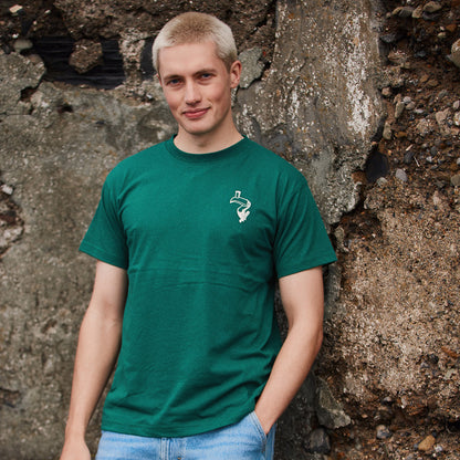 Man wearing green Guinness Toucan T shirt with small white logo on the left chest