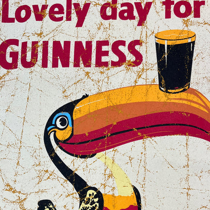 Close-up of the yellow Guinness tee graphic with a colorful toucan and a pint