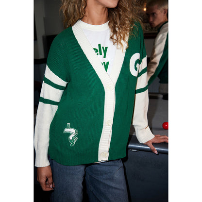 Front view of green and cream knitted Guinness cardigan with white trim and button placket