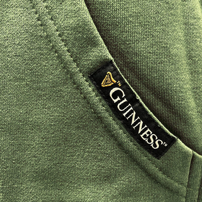 Guinness brand tag on the green hoodie pocket