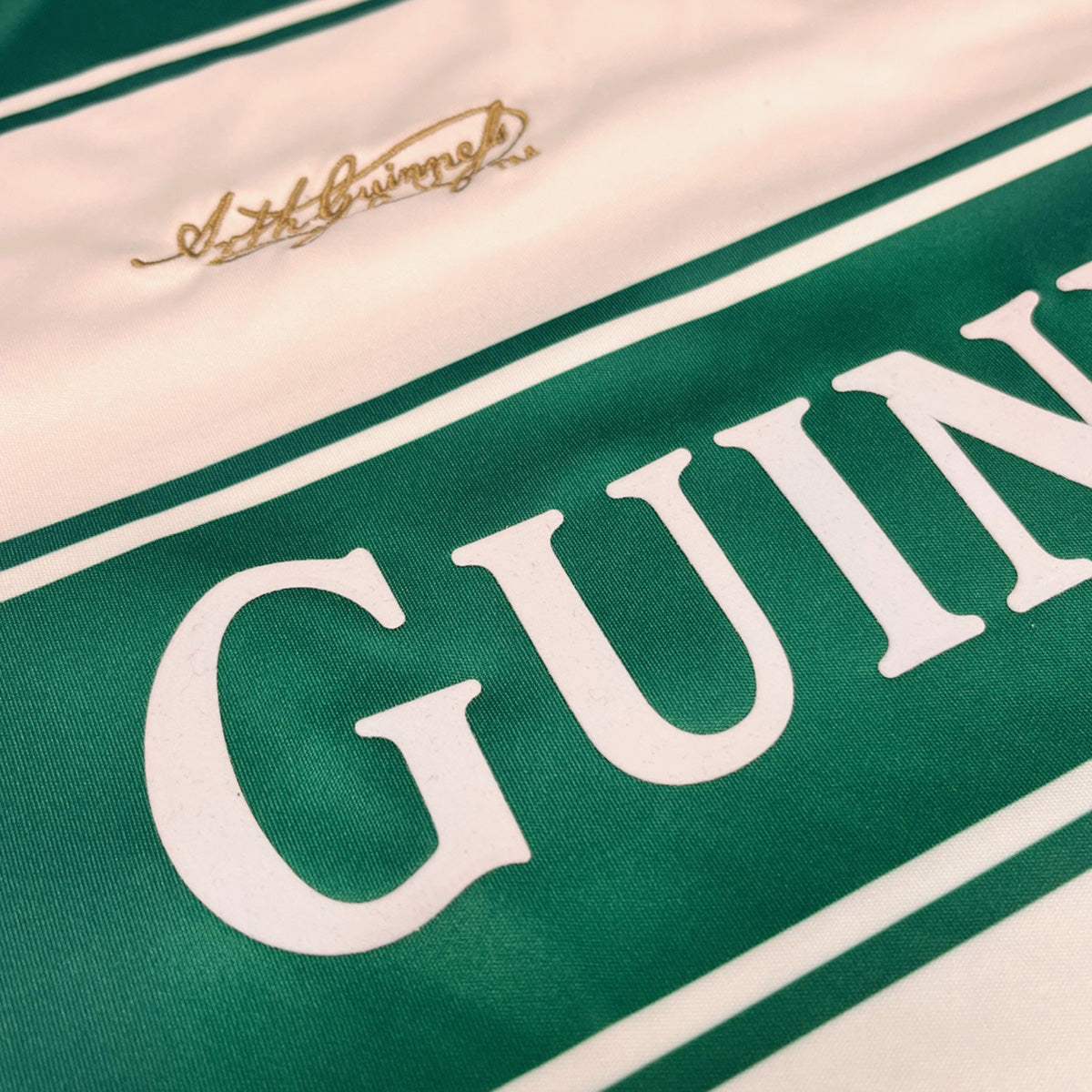Guinness Green & White Striped Football Top