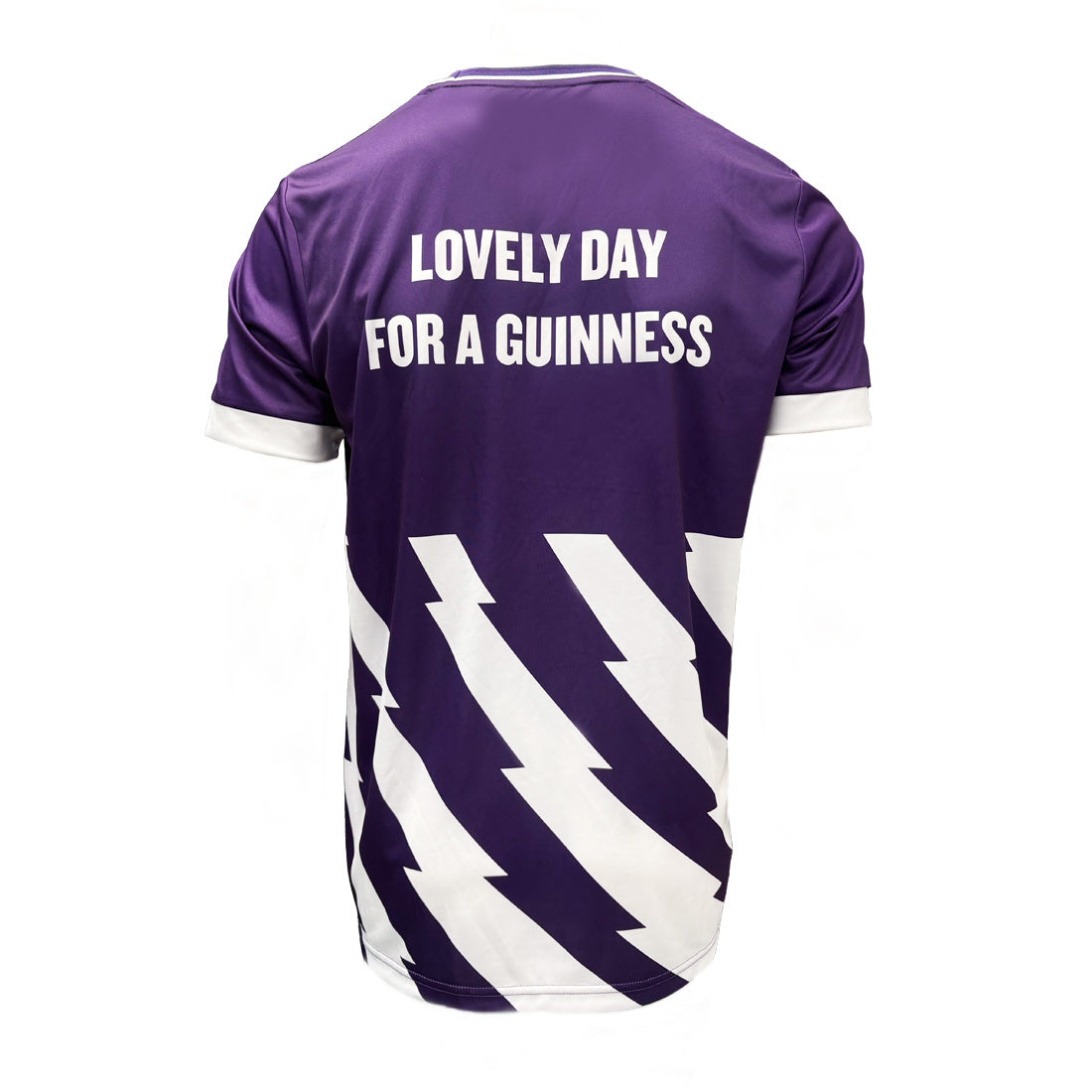 Back view of purple Guinness Premier League football top with the white slogan Lovely Day For A Guinness and diagonal white pattern.