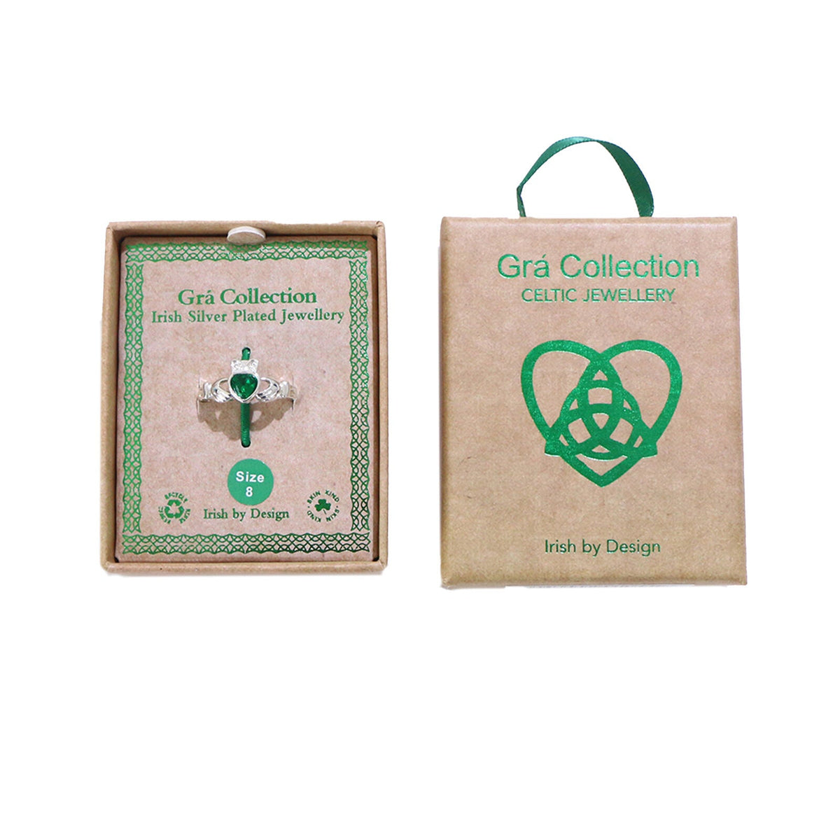 Silver ring with green heart stone in cardboard box with Celtic design