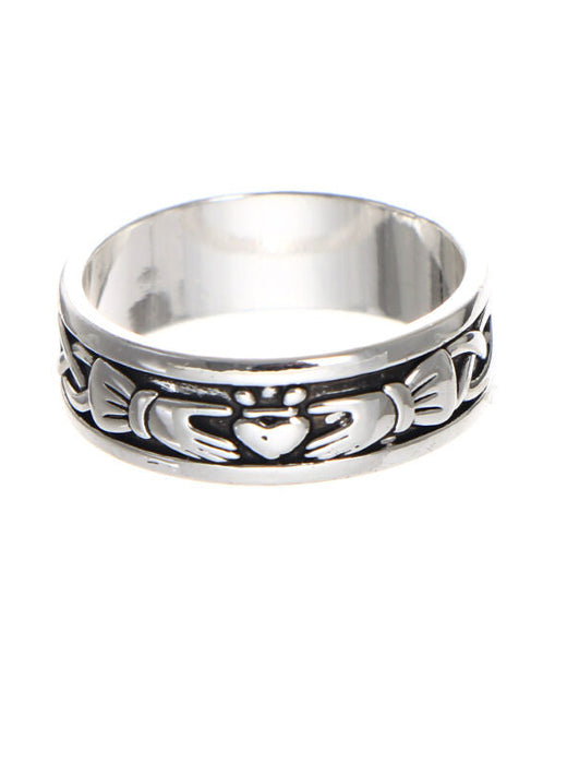 Silver ring with engraved hands holding a heart symbol
