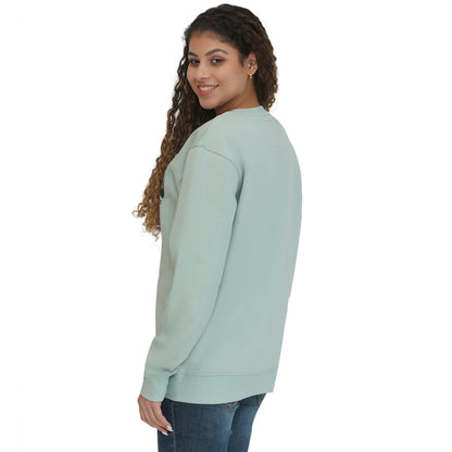 Back view of a woman wearing Ireland Badge Unisex Pistachio Sweatshirt.
