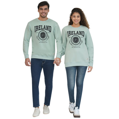 Pair of models wearing Ireland Badge Unisex Pistachio Sweatshirts with front crest design.