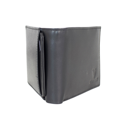 Side view of Guinness black leather wallet showing stitching and embossed logo